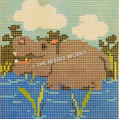 rhino in water with green bushes behind and blue sky with clouds