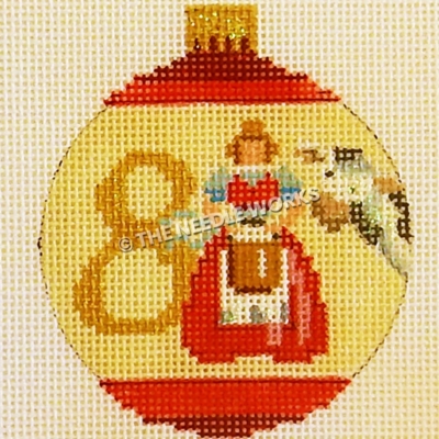 yellow and red ornament with maid milking next to cow and number 8 in gold