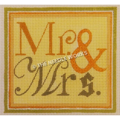 yellow square with Mr. & Mrs. written in gold and green with orange, white, and green border
