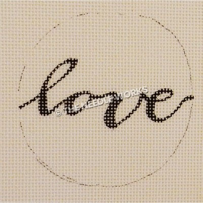 white ornament with love in black script