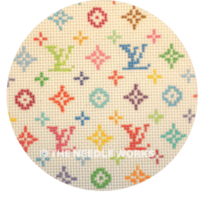 white ornament with Louis Vuitton symbol in variety of colors