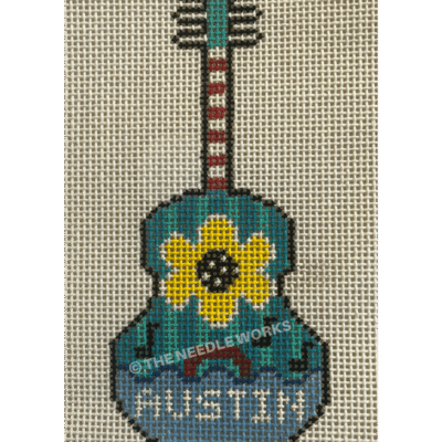 blue and green guitar with Austin in white and yellow flower