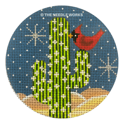 round ornament with red cardinal on cactus with night sky