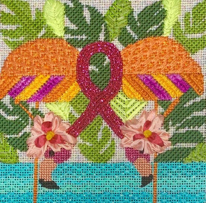 pink flamingos in water with breast cancer awareness pink ribbon tying them together