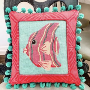pink striped fish pillow with seafoam green background