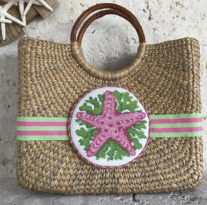 pink seashell canvas on wicker purse