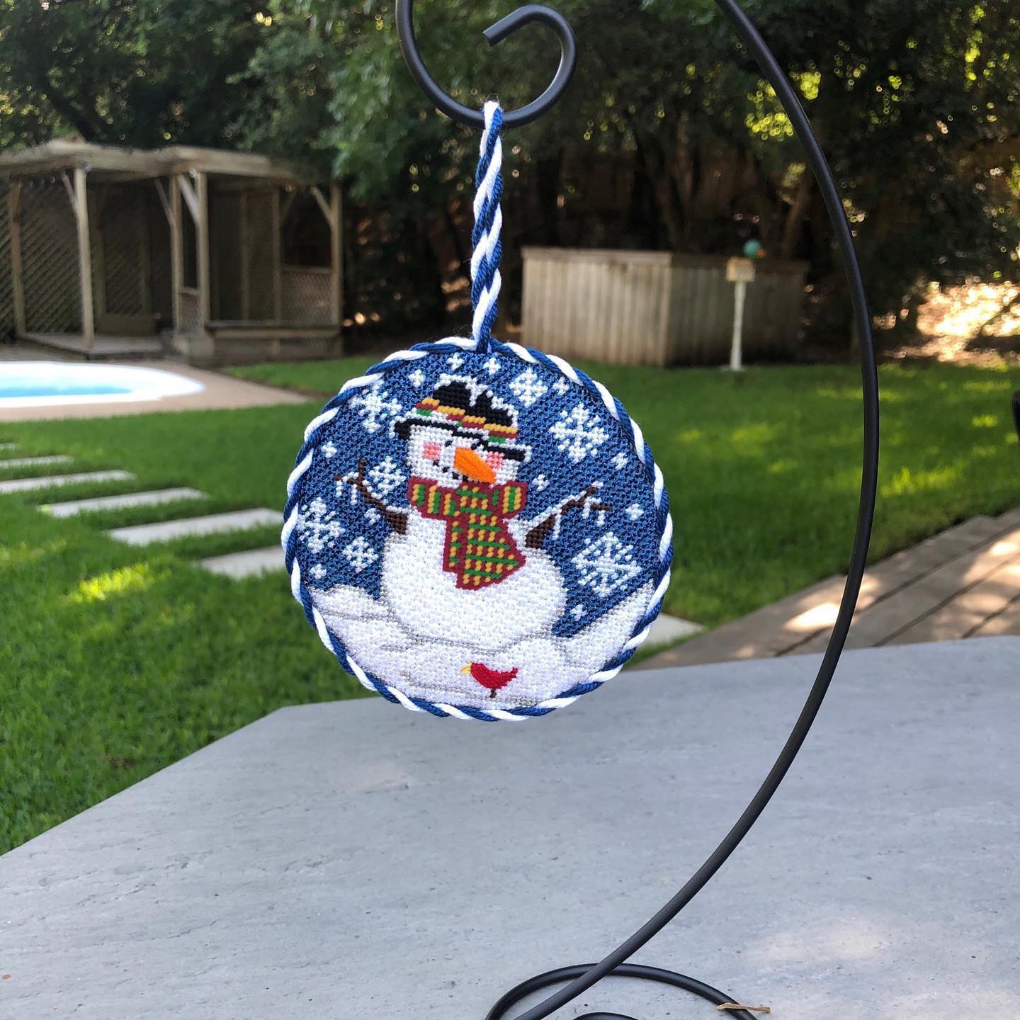 Susan Cluck ornament finishing on metal stand